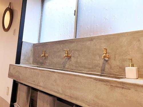 a bathroom with a sink and a mirror at Cactus Inn / Vacation STAY 51554 in Miyazaki