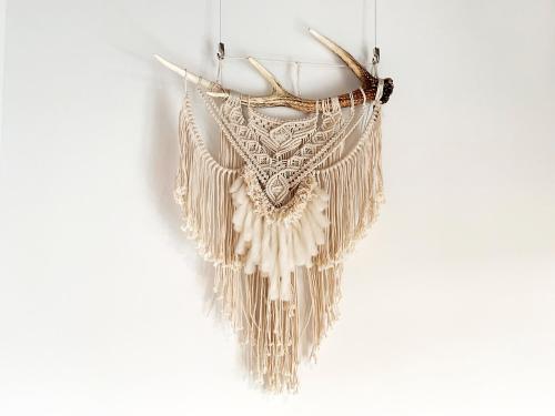 a pair of fringe earrings hanging on a wall at Cactus Inn / Vacation STAY 51552 in Miyazaki