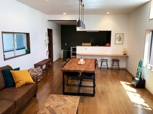 a living room with a couch and a table at Cactus Inn / Vacation STAY 51551 in Miyazaki
