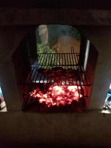an oven with a fire inside of it at B&B Aparthotel La Isleta in Las Galeras