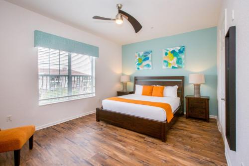 a bedroom with a bed and a window at Vista Cay at Epic Universe - Luxury 4 bedroom condo in Orlando