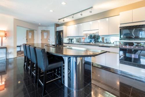 a kitchen with a table and chairs in it at The Ironwood on Blueberry Hill in Whistler