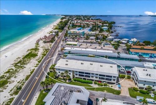 an aerial view of a beach with buildings and the ocean at Gulf Watch 204 Condo in Bradenton Beach