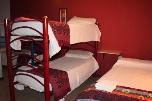 A bunk bed or bunk beds in a room at Hotel Casa Mia