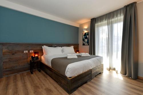 Posteľ alebo postele v izbe v ubytovaní Du Parc Hotel