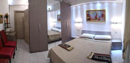 Ένα ή περισσότερα κρεβάτια σε δωμάτιο στο Appartamento Residence Canalotto