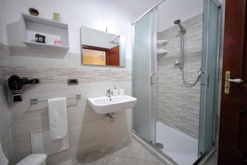 a bathroom with a sink and a shower at B&B Milena in Paceco