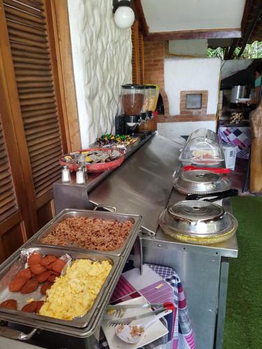 
a buffet of food on a table at Hotel Bugabutik in Puerto Viejo
