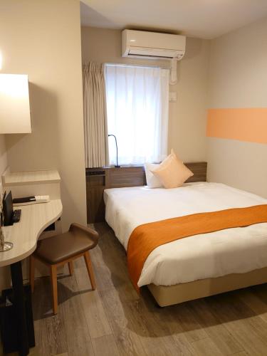 Postel nebo postele na pokoji v ubytování SARASA HOTEL Dotonbori