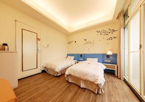 Postel nebo postele na pokoji v ubytování Backpacker B&B