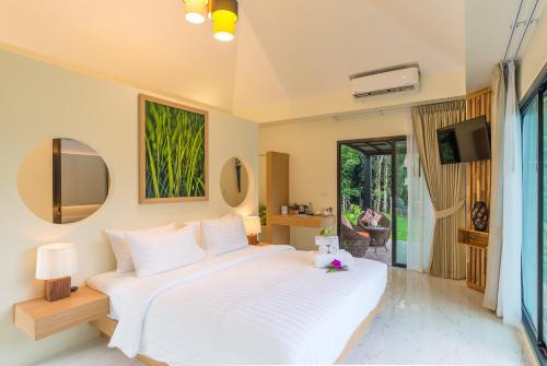 Katil atau katil-katil dalam bilik di Aonang Eco Villa - SHA Extra Plus