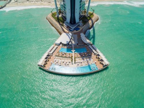 an aerial view of a cruise ship in the water at Burj Al Arab Jumeirah in Dubai
