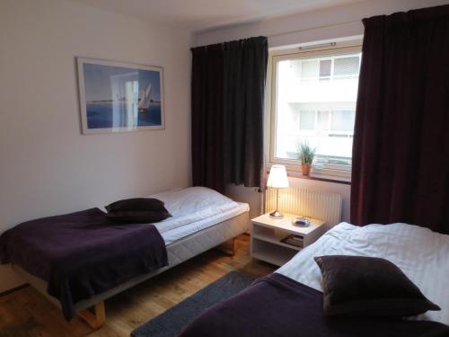 Säng eller sängar i ett rum på Hotel Göingehof