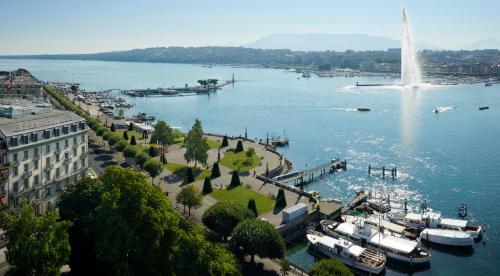 a view of a harbor with boats in the water at Beau-Rivage Genève in Geneva