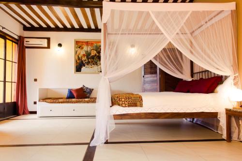 מיטה או מיטות בחדר ב-Hotel Bougainviller