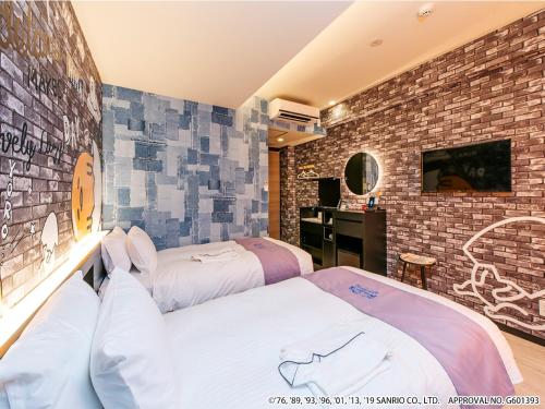 a hotel room with two beds and a tv at HOTEL OKINAWA WITH SANRIO CHARACTERS in Naha