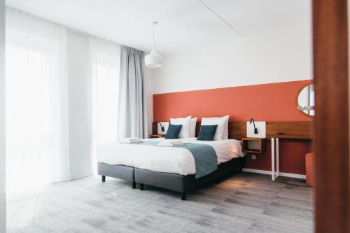 Кровать или кровати в номере Dormio Resort Maastricht Apartments