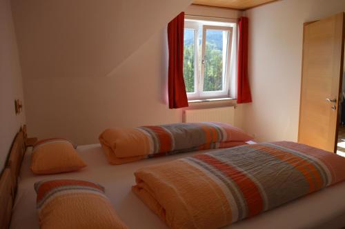 Ένα ή περισσότερα κρεβάτια σε δωμάτιο στο Ferienwohnung im Herzen des Renchtals