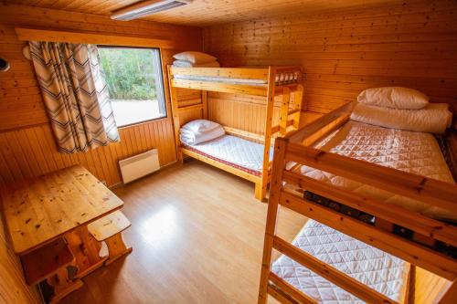 an overhead view of a bedroom with two bunk beds at Motelli Rovaniemi in Rovaniemi