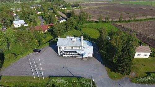 an aerial view of a house with a driveway at Gasthaus.himanka in Himanka