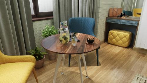 a table and a chair in a room at Centric Baku Boutique Hotel in Baku