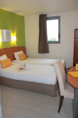 Katil atau katil-katil dalam bilik di The Originals City, Hotel Novella Confort, Nantes Est