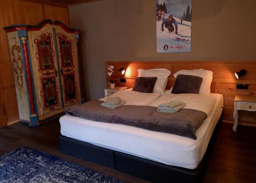 מיטה או מיטות בחדר ב-De Nussi's Chalet 1