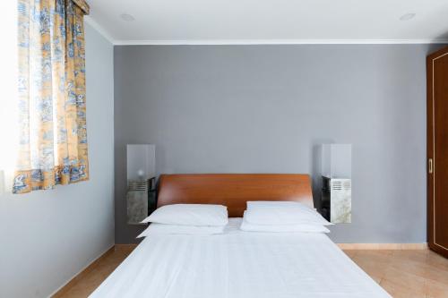 Llit o llits en una habitació de Crosti Apartments