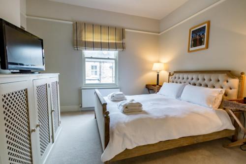 Un pat sau paturi într-o cameră la 34 St Olave's Road