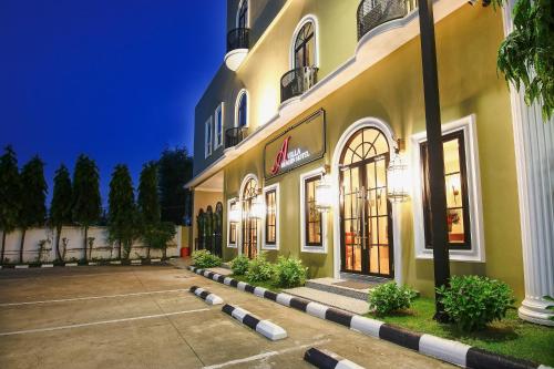 a store front of a building at night at A Villa Hua Hin Hotel in Hua Hin