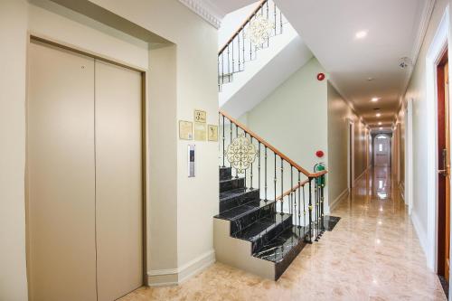 a staircase in a home with a black and white at A Villa Hua Hin Hotel in Hua Hin