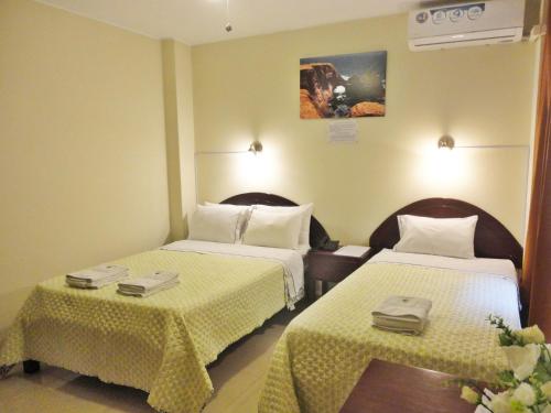 Una cama o camas en una habitación de Hotel Torontel