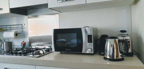 a microwave oven sitting on a counter in a kitchen at La Turr de Mezz- Bellagio LCA in Bellagio