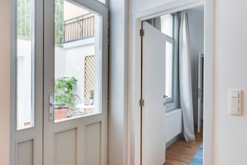 a room with a door and a window at Newton Boutique Hotel Residences - Brussels EU Area in Brussels