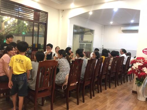 a group of people sitting in chairs in a room at Thanh Truc Hotel Ca Mau in Cà Mau