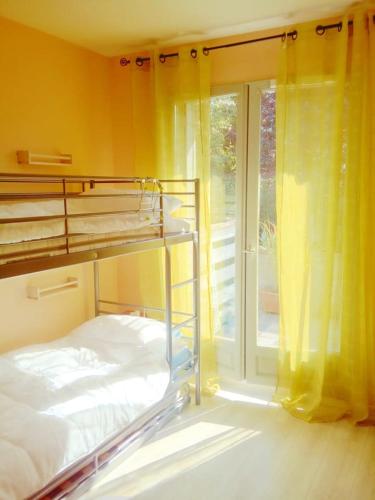 a bedroom with a bunk bed and a window at Camp de base in Le Bourg-dʼOisans