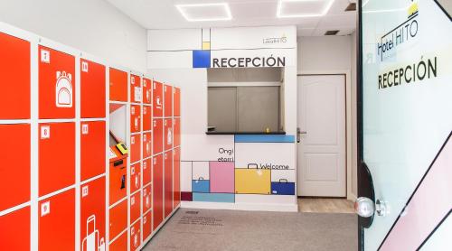 a room with a colorful tile wall and a door at Hotel Hito in Vitoria-Gasteiz