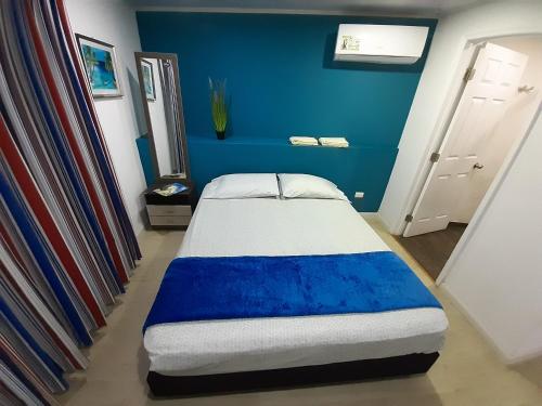 Katil atau katil-katil dalam bilik di Palmare House