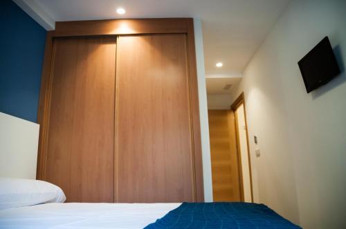 Postel nebo postele na pokoji v ubytování Hostal Mónaco