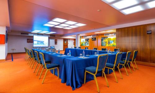 a conference room with a long table and chairs at Hotel Attica21 Las Rozas in Las Rozas de Madrid