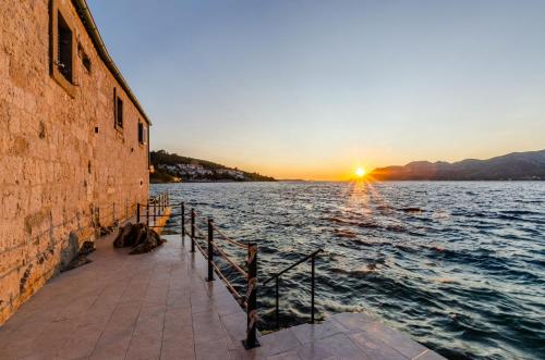 a sunset over a large body of water at Villa Gabriela in Korčula