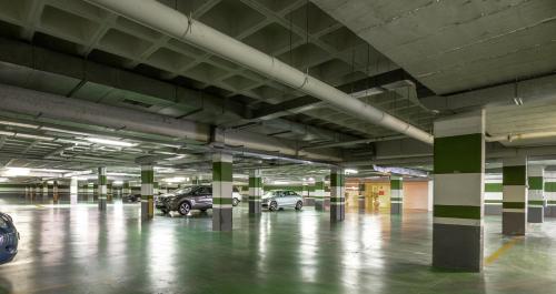 an empty parking garage with cars parked in it at Hotel Attica21 Las Rozas in Las Rozas de Madrid