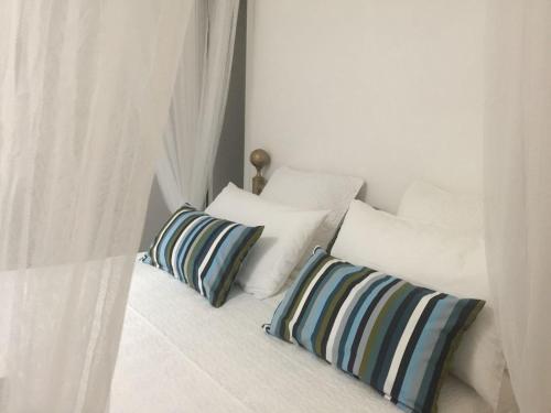 two pillows sitting on a bed in a room at Style di Elisabetta Notari in Borghesiana 