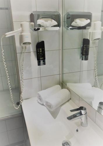 Ένα μπάνιο στο A&M Hotel Barsinghausen