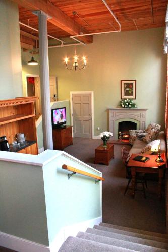a living room with a baseball bat on a table at The Historic Brookstown Inn, Trademark Collection by Wyndham in Winston-Salem