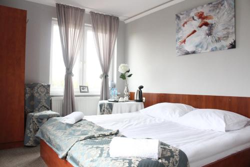 Katil atau katil-katil dalam bilik di Restauracja Hotel Kassandra