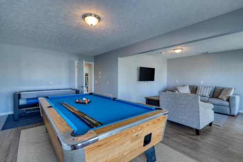 a room with a pool table and a couch at Tranquil Seas in Saint Joe Beach