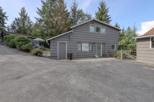 a house with a driveway in front of it at The Tides Retreat in Gig Harbor