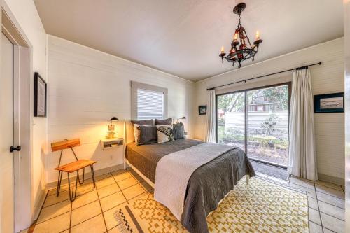 a bedroom with a bed and a window at Cosmos Corner House in Fredericksburg