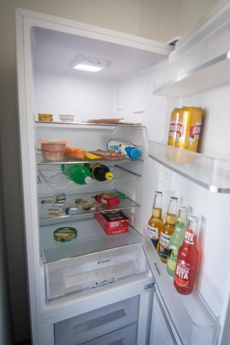 an open refrigerator filled with lots of food and drinks at Sky in Slavonski Brod